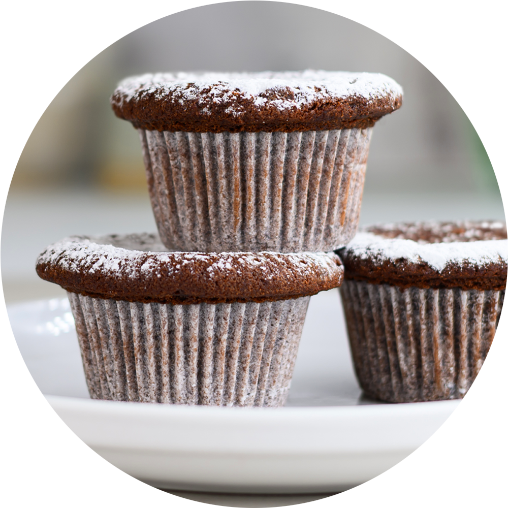 3 chocolate cupcakes stacked on a white plate Dessert Kitchen