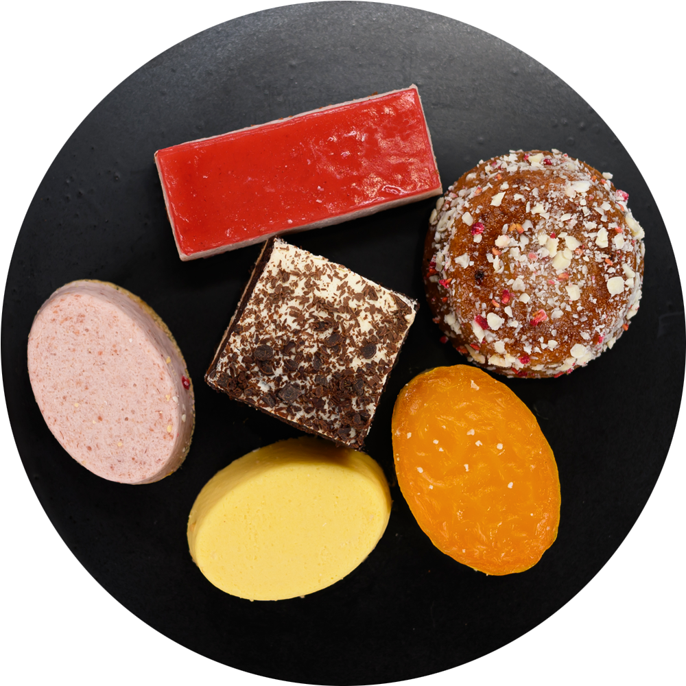 Assorted colorful soap bars on a black circular background. Dessert Kitchen